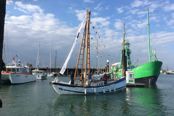 Boleh and volunteer crew putting out the bunting on return to her Haslar berth.